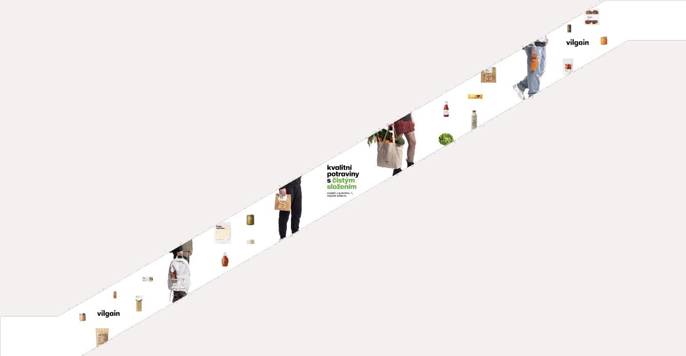 Escalator side panels with shoppers and products walking up