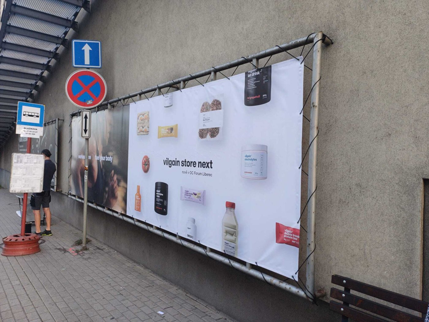 Vilgain store next banner on a construction fence